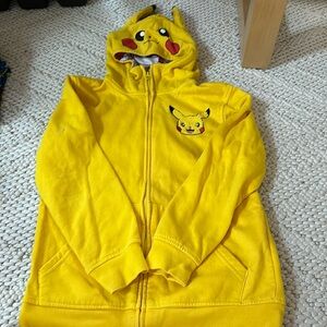 Preowned, good condition Pokémon zip up hoodie.